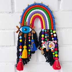 Macrame rainbow with golden eye and elephant charm, Colorful boho home decor, Unique wall decoration, Perfect bohemian gift idea, Eclectic home decor