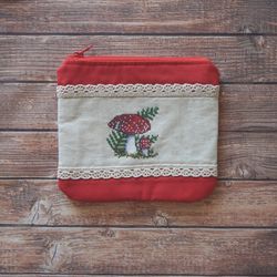 Cosmetic bag with embroidered mushrooms