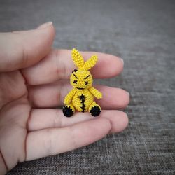 Creppy cute bunny. Miniature crochet bunny. Amigurumi toy.