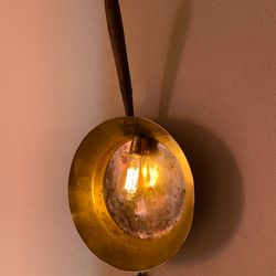 Plug in wall sconce made from antique copper ladle