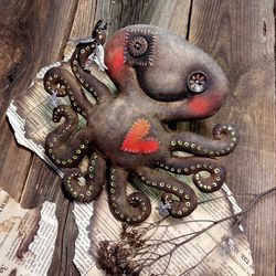Small cheerful octopus with brown eyes