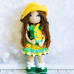 Knitted doll in green dress. Handmade crochet. Amigurumi doll in a yellow hat. Birthday present for a girl.