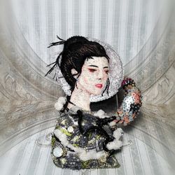 Large 3D brooch with an oriental girl and a bird. Brooch embroidered with beads.