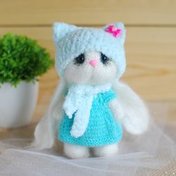 Crochet toy bunny is amigurumi toy.  White handmade bunny in dress.