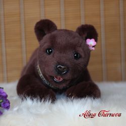 Teddy bear. Nice gift. Toy bear. A gift for a loved one. Love to the animals. Plush bear toy. Realistic toy.