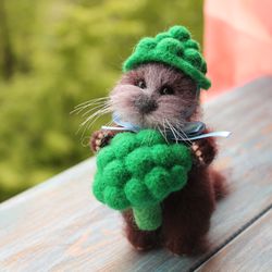 Felted baby otter with broccoli
