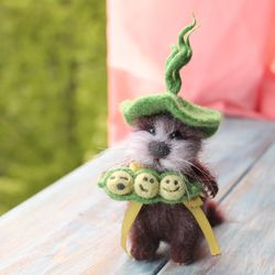Felted otter with green peas