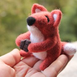 Felted toy fox with chocolate