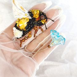 Brooch yellow bumblebee with glass flower, foldable wing