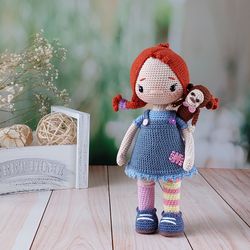 Handmade doll. The doll is a gift for a girl. A doll in a single copy. Crochet doll. A doll with a monkey.