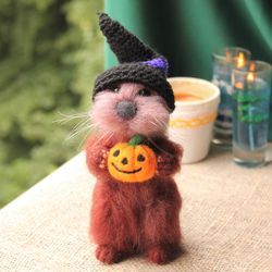 Felted otter with pumpkin