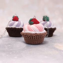 Keychain for a bag in the form of a cake.Whipped cream with strawberries. A gift for a woman. The pendant is crocheted.