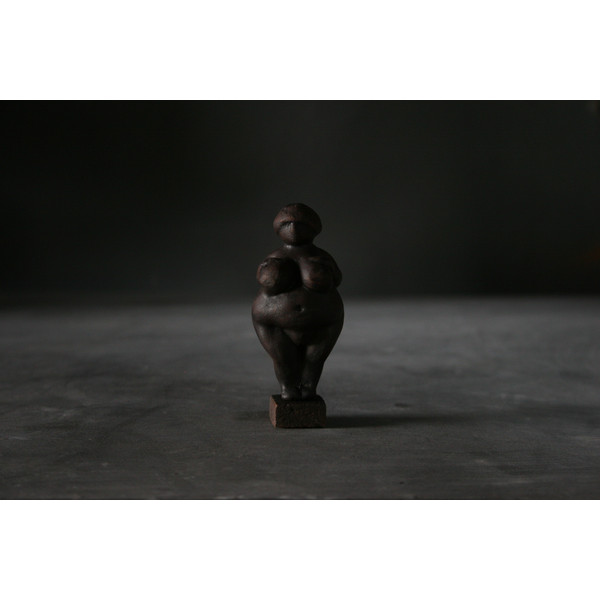 This figurine, made of ceramic, is based on a primitive Paleolithic Venus