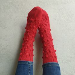 Warm red knitted handmade socks
