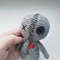 Creepy miniature voodoo doll with heart.jpg