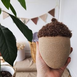 Stuffed biege acorn toy for Home decor. Acorn in Scandinavian style. Decoration of apartments and houses. Universal gift