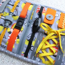 Toy with buckles on a construction  theme, Fidget blanket with fasteners and zippered pocket, Toddler travel busy toy