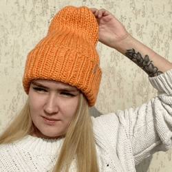 Bright warm fashionable hand-knitted hat