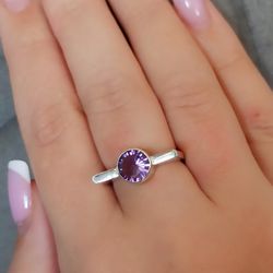 Silver ring with amethyst.
