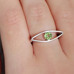 Silver ring with peridot .
