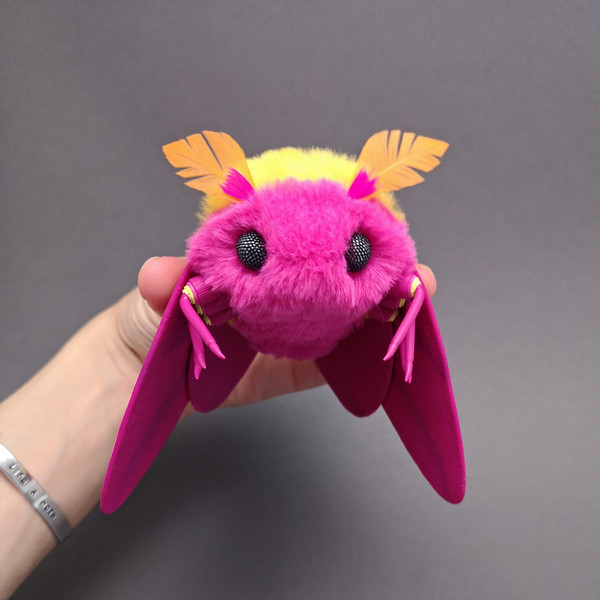 Rosy Maple Moth Doll in the hand