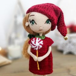 Elf doll girl. Christmas elf girl. Christmas gift girl with lollipop