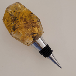 resin wine bottle stopper with embedded dried australian golden yellow dandelion and strawflowers
