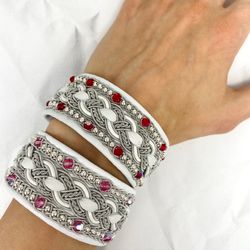 Wide women's Sami bracelet. Scandinavian design jewelry. White leather bracelet with shining glass beads