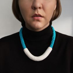 White U shape necklace with light blue cord, polymer clay and cotton contemporary jewelry