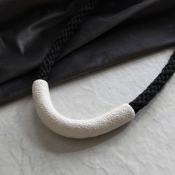 White U shape necklace with black cord, polymer clay and cotton contemporary jewelry