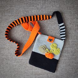 Phone bag handmade crochet decorated with pumpkin. Crochet bag. Mobile phone bag.