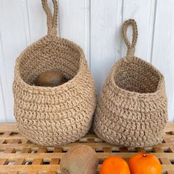 A set of wall-mounted baskets for storing onions, garlic, other vegetables and fruits.  Storage grid onion, garlic
