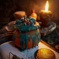 Witch magic money candle, witch cauldron