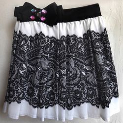 Gathered skirt with elasticated waist.  Handmade