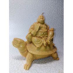 Candle figurine. Buddha on a turtle. Wax candle. Beeswax candle. Statuette.