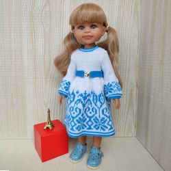Dress for warm weather, knitted from yarn, white with turquoise ornament.