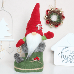 Red Christmas gnome in a green Santa boot / Idea holiday gift for family