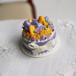 Dolls house miniature food, purple Easter cake with yellow flowers and rabbits for dollhouse at 1:12 scale