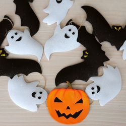 Halloween garland with ghosts and bats. Halloween decoration. Halloween pumpkin banner ornaments. Halloween home decor