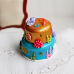 Miniature blue and gold nautical cake for dolls, dollhouse mini food at 1:12 scale
