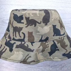 Cotton bucket hat with animalistic, camouflage cat print. Cute summer hat for travel and camping. Fashion designer hat.