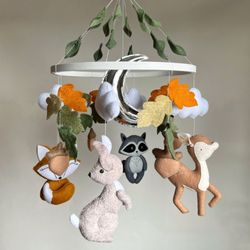 Forest animal mobile for woodland nursery. Fox, Bambi, Raccoon and Hare around the oak tree with leaves
