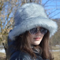 arctic fox bucket hat made of faux fur. furry bucket hat. gray white fluffy bucket hat. cute fuzzy winter fox hat.