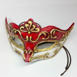 Red Venetian masquerade mask women to cosplay costume of Marie antoinette style design. Women mask to masquerade costume