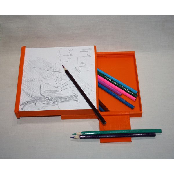 sliding sketchbox with pencils