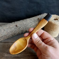 Handmade wooden spoon from birch wood for eating or serving
