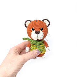 Brown plush tiger is a gift for a child