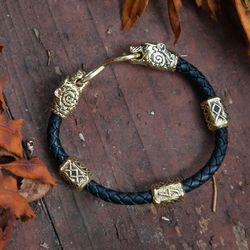 Bracelet on leather braided cord with bear heads and runes. Pagan viking bangle. Scandinavian handcrafted jewelry.