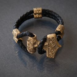 Bracelet with Thor Hammer Mjolnir and runes on braided leather cord. Massive scandinavian Pagan handcrafted jewelry.