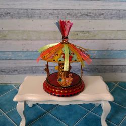 Miniature carousel. Dollhouse miniature.1:12 scale.